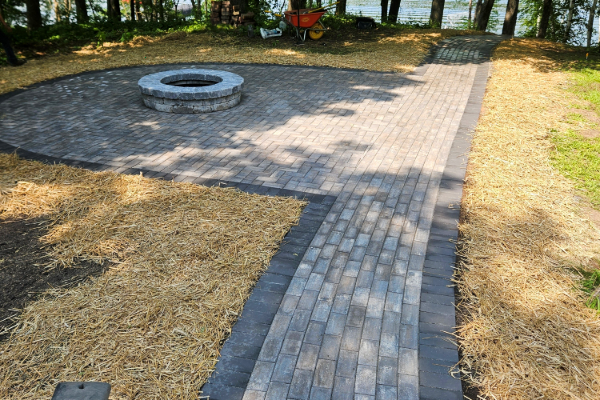 Brick paver walkway and firepit.
