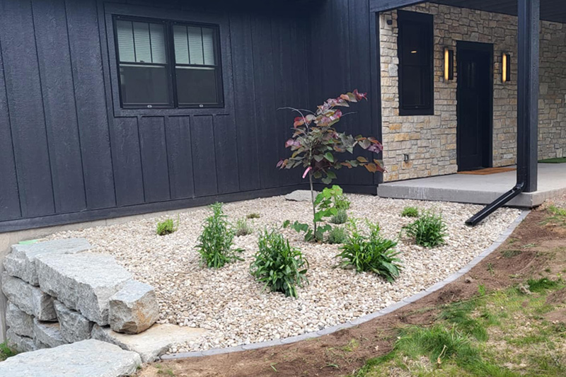 9:10 AMClaude responded: New foundation planting bed with a young ornamental tree, perennials, and decorative gravel at a modern homeNew foundation planting bed with a young ornamental tree, perennials, and decorative gravel at a modern home